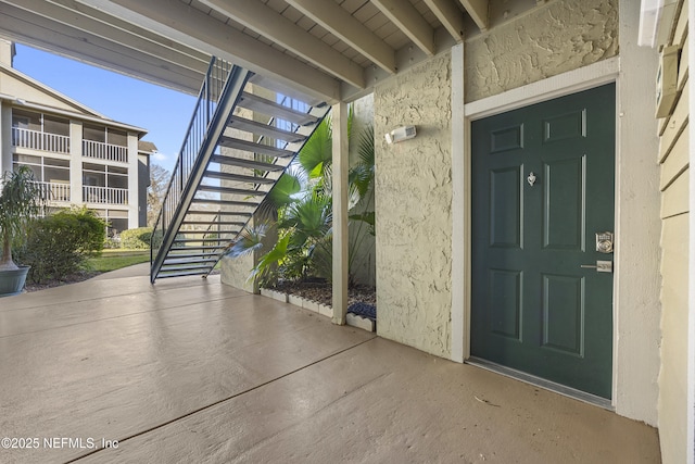 entrance to property featuring a patio