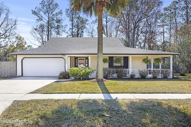 view of front of house with a porch, a garage, and a front yard