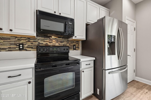 kitchen with backsplash, white cabinets, light hardwood / wood-style floors, and black appliances