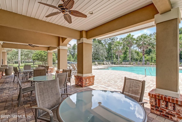 view of patio / terrace featuring a community pool and ceiling fan