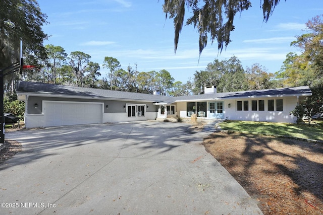 single story home featuring a garage