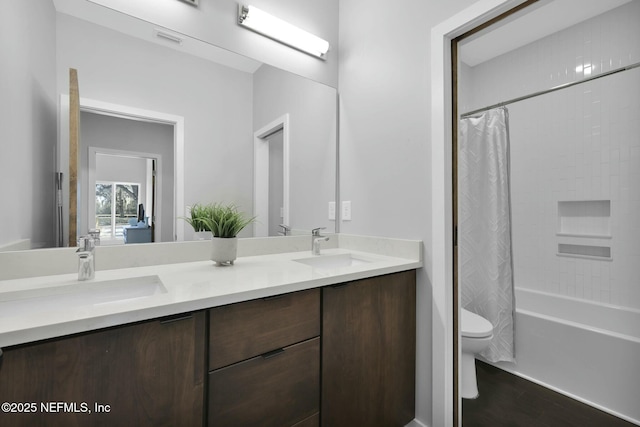 full bathroom featuring vanity, toilet, wood-type flooring, and shower / bath combo with shower curtain