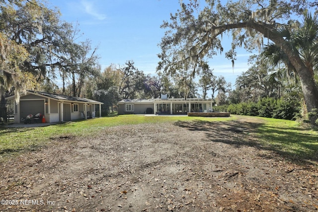 view of yard featuring a garage