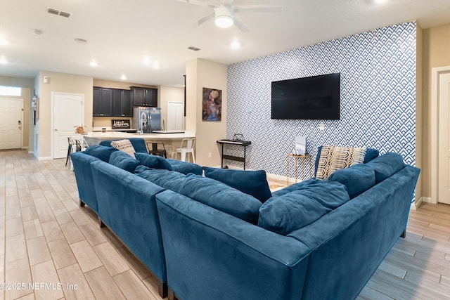 living room featuring ceiling fan