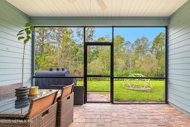 sunroom featuring wooden ceiling