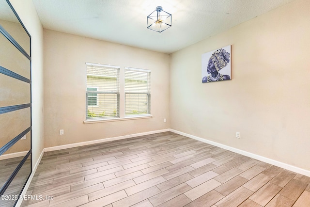 spare room featuring light hardwood / wood-style flooring