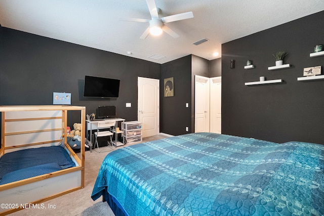 carpeted bedroom featuring ceiling fan