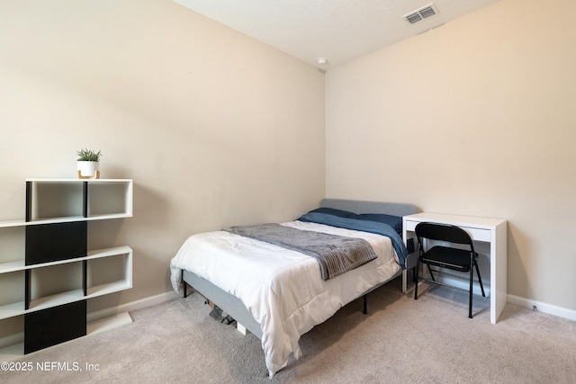 bedroom featuring light carpet