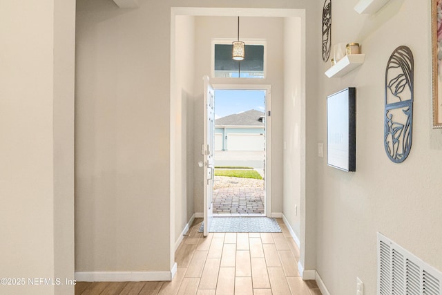 entryway with light hardwood / wood-style flooring