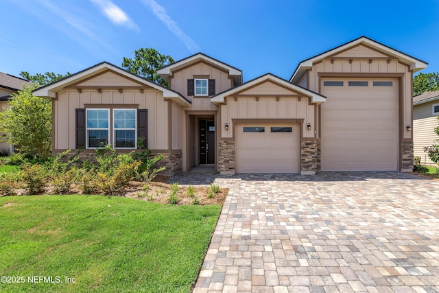 view of front of house with a garage and a front lawn