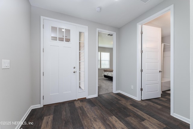 entrance foyer with dark hardwood / wood-style floors