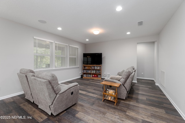 living room with dark hardwood / wood-style flooring