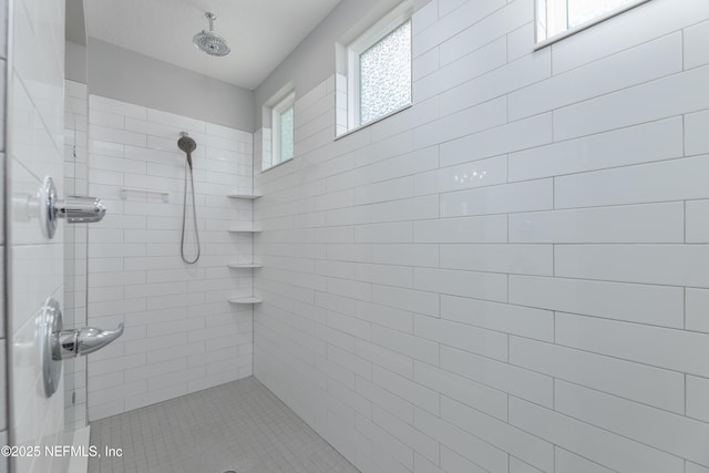 bathroom featuring a tile shower