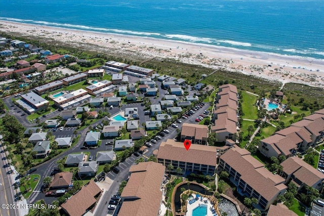 aerial view featuring a view of the beach and a water view