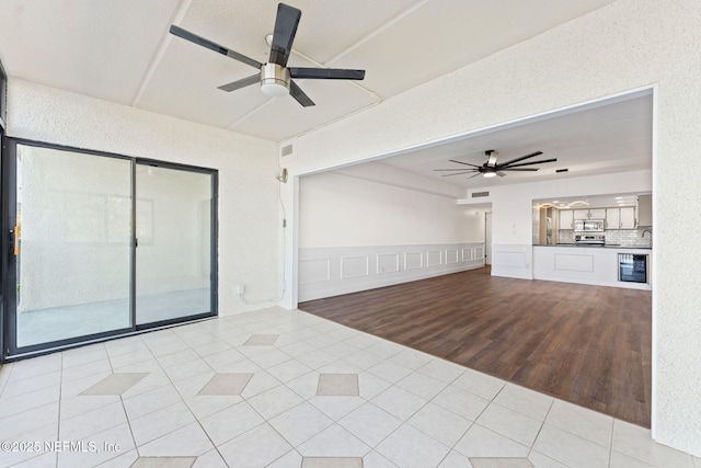 2280 Shepard St Unit 204, Jacksonville, FL 32211 - unfurnished living room featuring light tile patterned flooring and ceiling fan