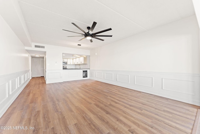 2280 Shepard St Unit 204, Jacksonville, FL 32211 - unfurnished living room featuring ceiling fan, sink, and light hardwood / wood-style floors