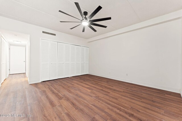 2280 Shepard St Unit 204, Jacksonville, FL 32211 - unfurnished bedroom featuring ceiling fan, dark hardwood / wood-style floors, and a closet