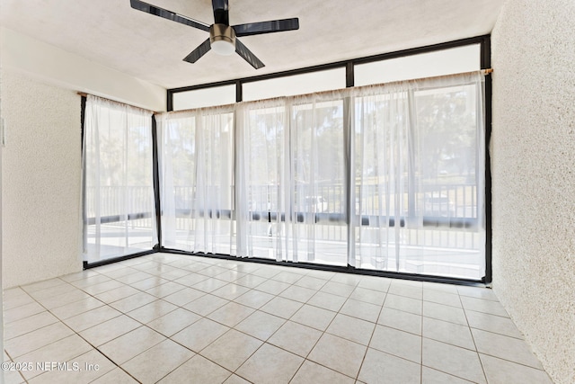 2280 Shepard St Unit 204, Jacksonville, FL 32211 - tiled empty room featuring plenty of natural light and ceiling fan