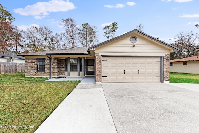 ranch-style home featuring a garage and a front yard