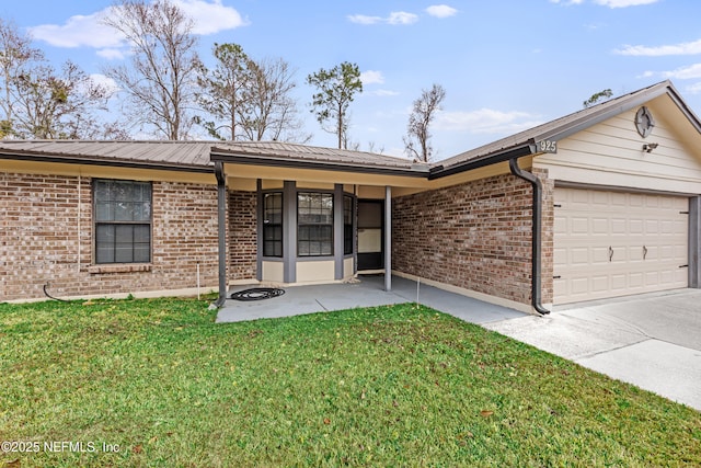 ranch-style home featuring a garage and a front lawn