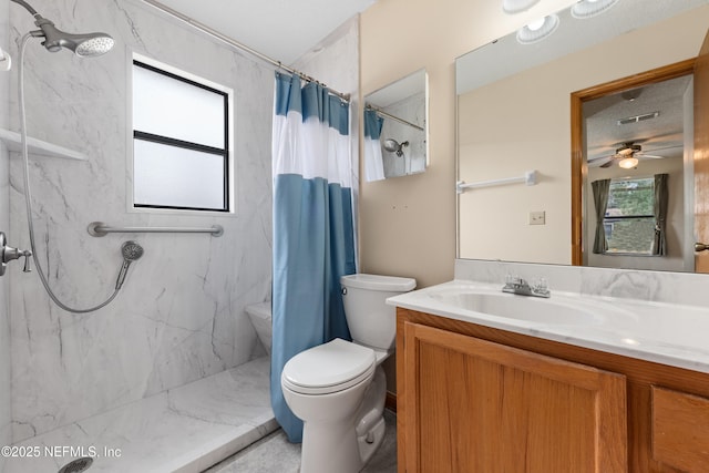 bathroom with a shower with curtain, vanity, and toilet