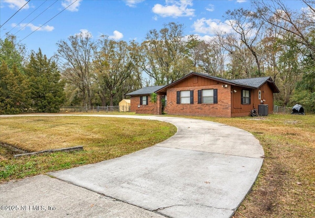 view of property exterior featuring a yard and central air condition unit