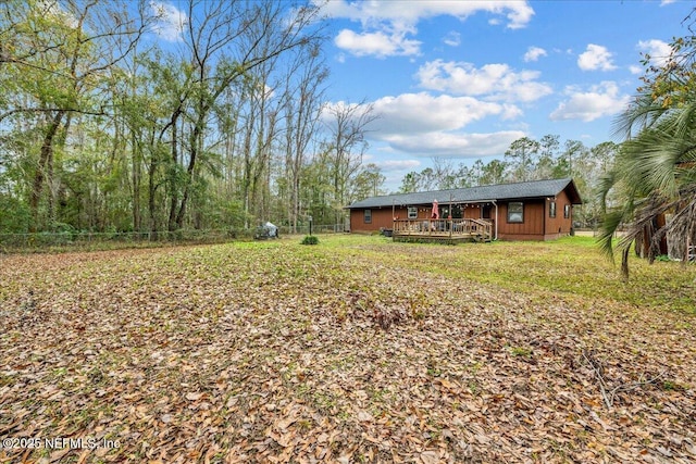 view of yard featuring a wooden deck