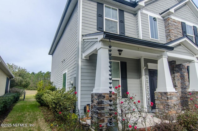 view of side of home featuring stone siding