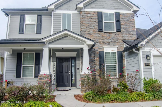 craftsman house with stone siding