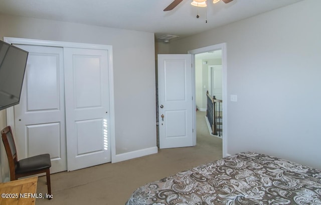 bedroom with carpet floors, a closet, and a ceiling fan