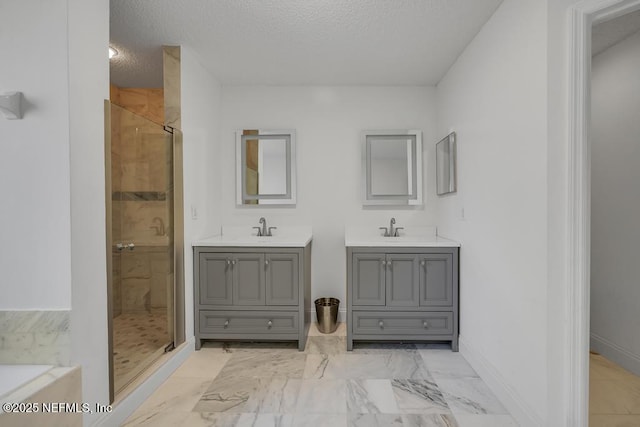 bathroom featuring vanity, plus walk in shower, and a textured ceiling