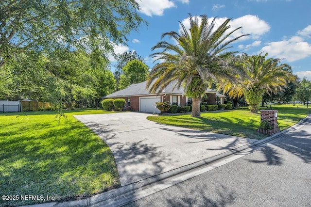 view of front of house featuring a garage and a front lawn