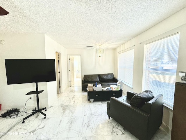 living room featuring a textured ceiling