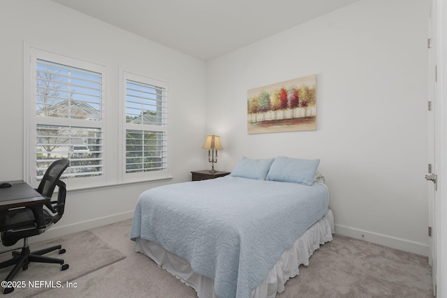 bedroom featuring light carpet