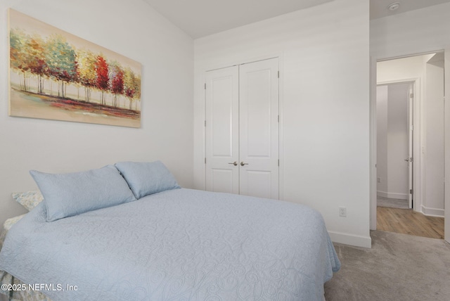 carpeted bedroom featuring a closet