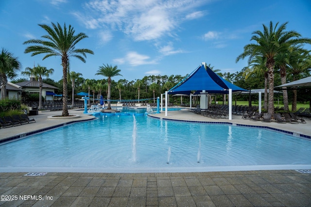 view of swimming pool with a patio area and pool water feature