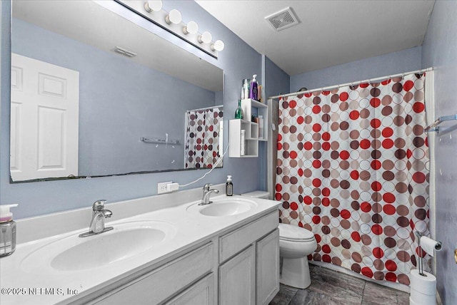 bathroom with a shower with curtain, vanity, and toilet