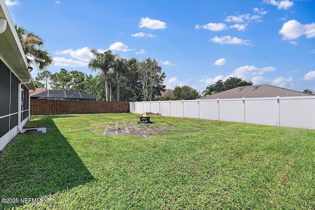 view of yard featuring a fire pit