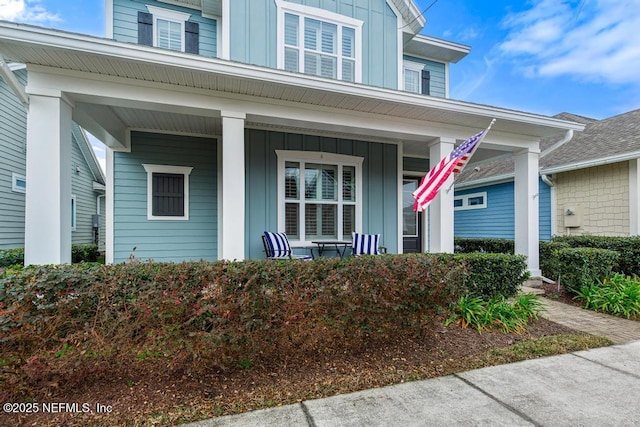 entrance to property featuring covered porch