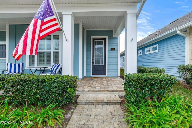 property entrance with covered porch