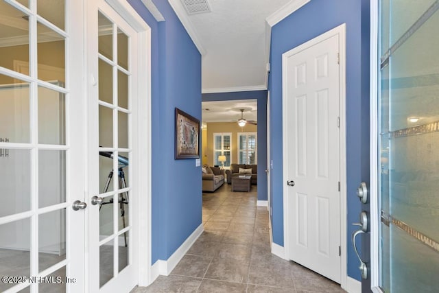 interior space with french doors and crown molding