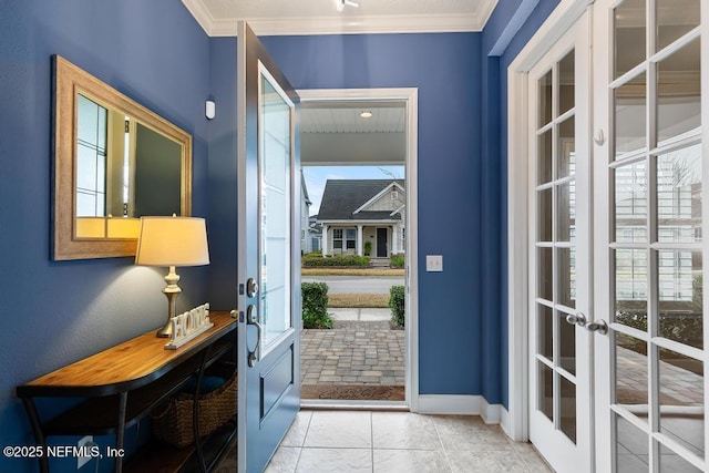 entryway featuring french doors and crown molding