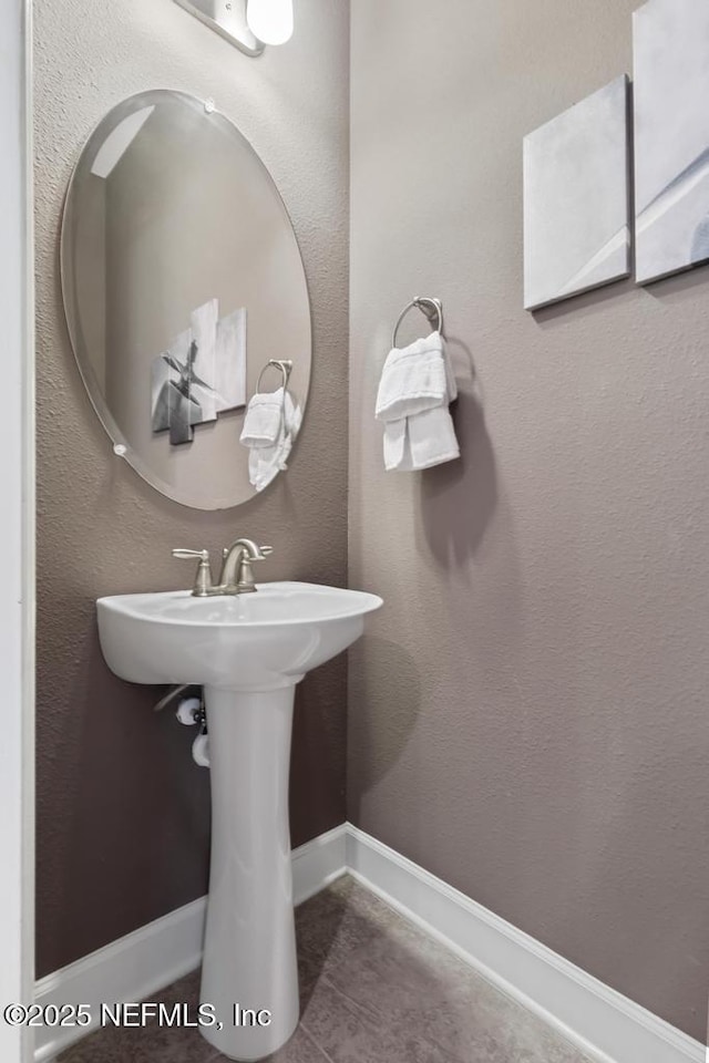 bathroom with tile patterned floors