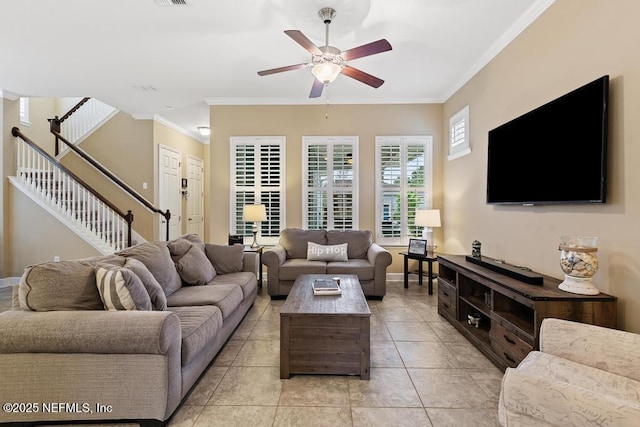 tiled living room with ornamental molding and ceiling fan