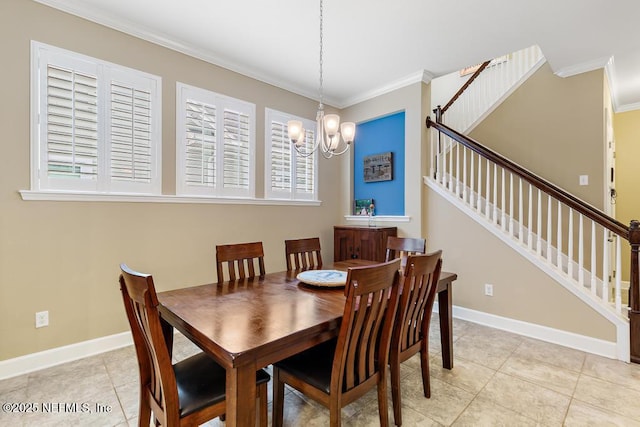 tiled dining area featuring an inviting chandelier and crown molding