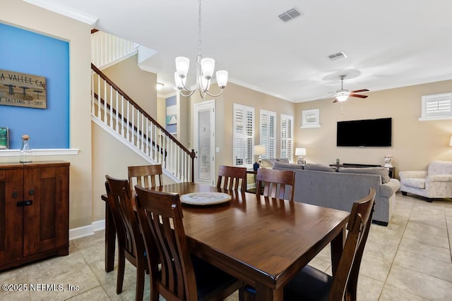 dining space featuring ornamental molding, ceiling fan with notable chandelier, and light tile patterned floors