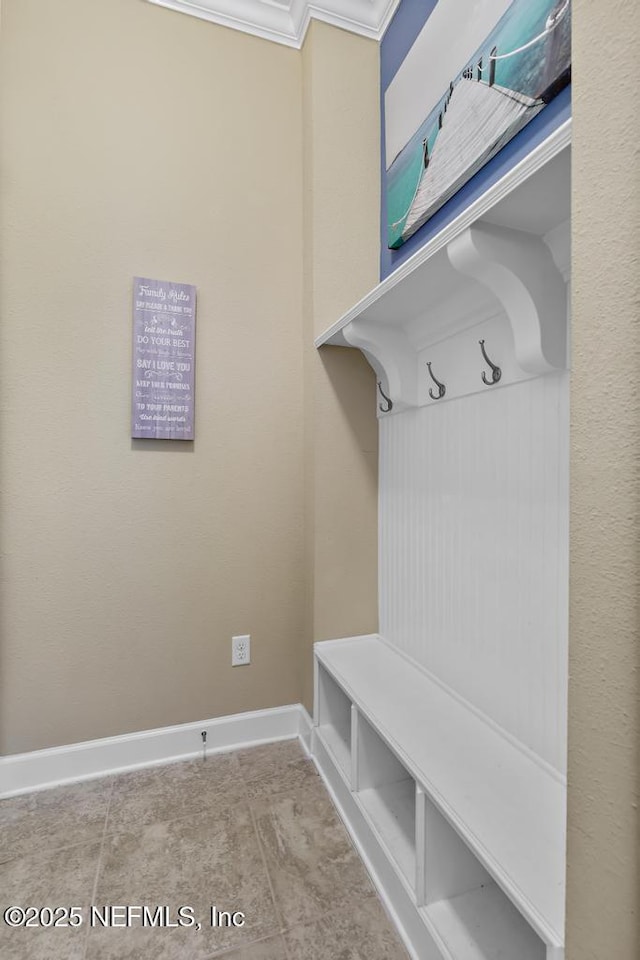 mudroom featuring ornamental molding