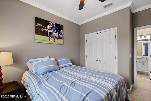 bedroom with ornamental molding, light carpet, ceiling fan, and a closet