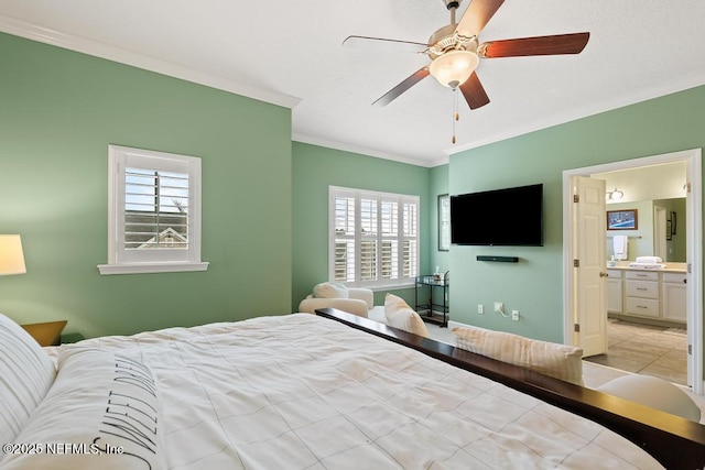 bedroom with connected bathroom, crown molding, and ceiling fan