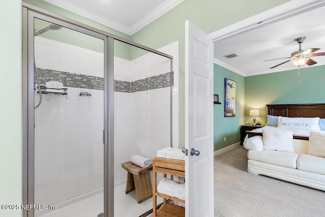 bathroom with crown molding, a shower with door, and ceiling fan